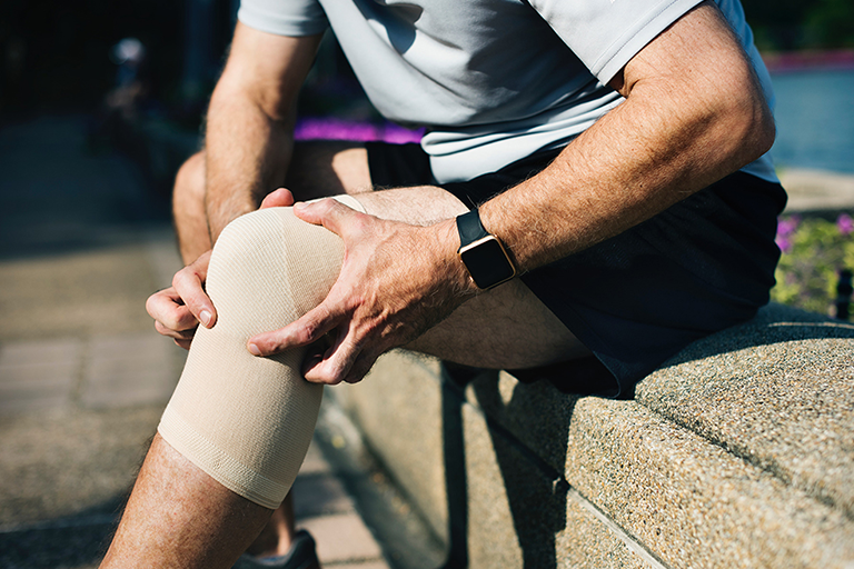 Amino Acid Deficiency, man holding his leg in pain