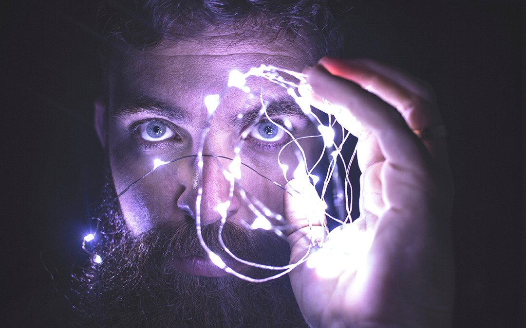 Faster Thinking, man holding LED lights